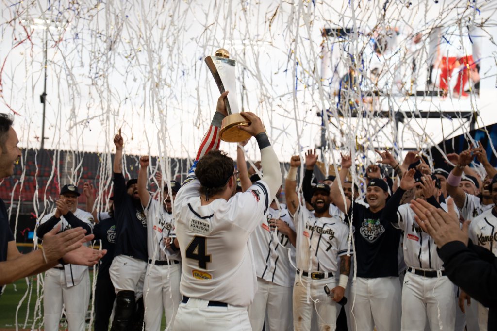 Claudio Finol and the Kane County Cougars hoist the 2026 Baseball Champions League Americas trophy